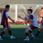 RYAN SPARKS | THE DAILY WORLD Montesano midfielder Andrew Melendez, left, celebrates with defenders Spencer Lovell and James Busche (22) after scoring a goal in the second half of a 3-2 win over La Center in the 1A District 4 Tournament on Tuesday in Montesano.