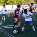 RYAN SPARKS | THE DAILY WORLD Montesano junior forward Felix Romero (15) holds possession against La Center midfielder Chemo Esquivel-Soto during a 3-2 win over La Center in the 1A District 4 Tournament on Tuesday in Montesano.