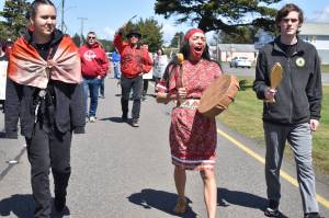 Clayton Franke / The Daily World
Alex Taylor, right, a sophomore in the North Shore School District, Lauren Nabahe, center, a native education program manager in King County, and Rain Gamble, a senior in the Seattle Public Schools district, walk down Point Brown Avenue in Ocean Shores on May 7 during an event to raise awareness for Missing and Murdered Indigenous People.