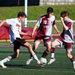 RYAN SPARKS | THE DAILY WORLD Montesanos James Busche (right) and Spencer Lovell (30) defend against Columbia (White Salmon) midfielder Matthew Miller during the Bulldogs 2-0 loss in a 1A District 4 semifinal game on Thursday in Montesano.