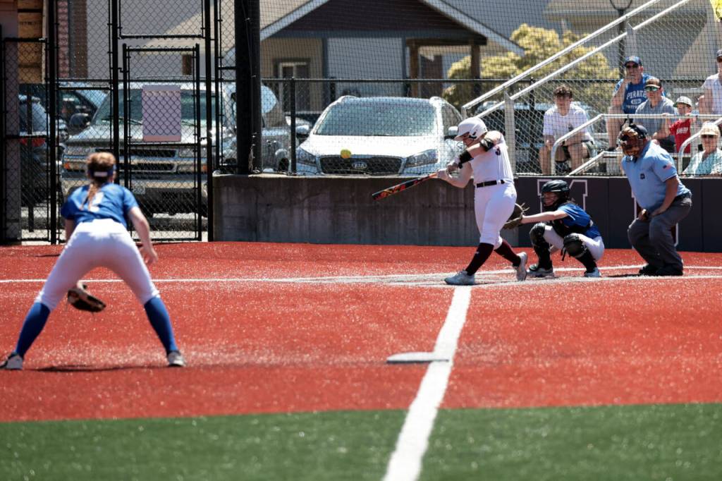 PHOTO BY SHAWN DONNELLY Montesanos Ali Parkin belts a home run during an 8-3 win over Adna on Saturday at Montesano High School.