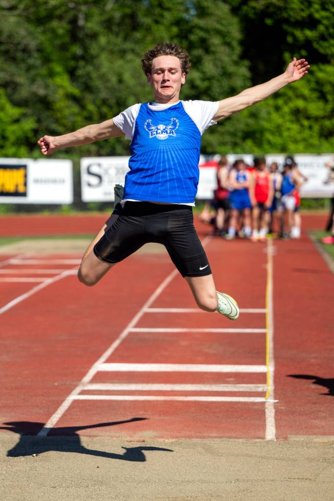 PHOTO BY FOREST WORGUM Elma sophomore Dayton Brookins won the long jump (pictured) and triple jump at the 1A Evergreen Championships on Friday at Montesano High School.