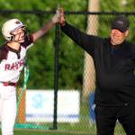 RYAN SPARKS | THE DAILY WORLD Raymond-South Bend center fielder Emma Glazier (left) gets a high five from first-base coach Jason Koski during a 12-3 win over Napavine on Monday in Montesano.