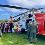 Michael S. Lockett / The Daily World
Ocosta School District students talk to Coast Guard helicopter aircrew during an outreach event on Tuesday.