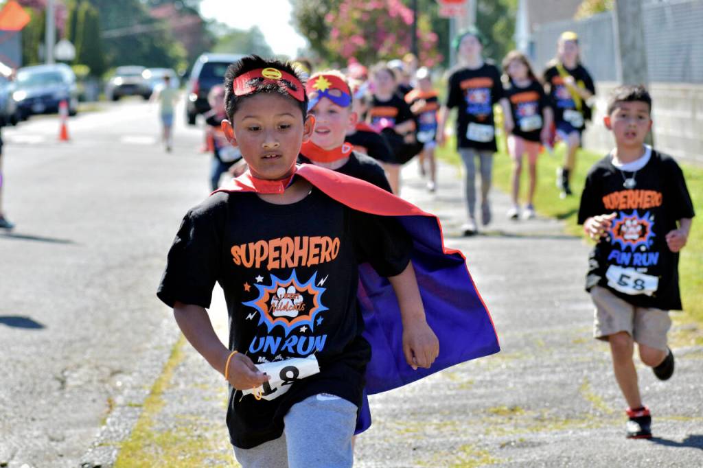 PHOTO BY RACHEL ROSE A competitor runs in the AJ West Fun Run on Friday in Aberdeen.