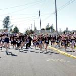 PHOTO BY RACHEL ROSE Participants take off at the start of the AJ West Fun Run on Friday in Aberdeen.