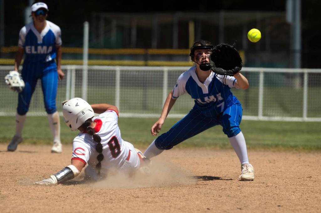 PHOTO BY FOREST WORGUM Montesano second baseman Aubree Simmons (right) makes a catch while Columbia (White Salmon) junior Josie Dickey slides during the Eagles 15-5 win in the first round of the 1A District 4 Tournament on Wednesday in Centralia.