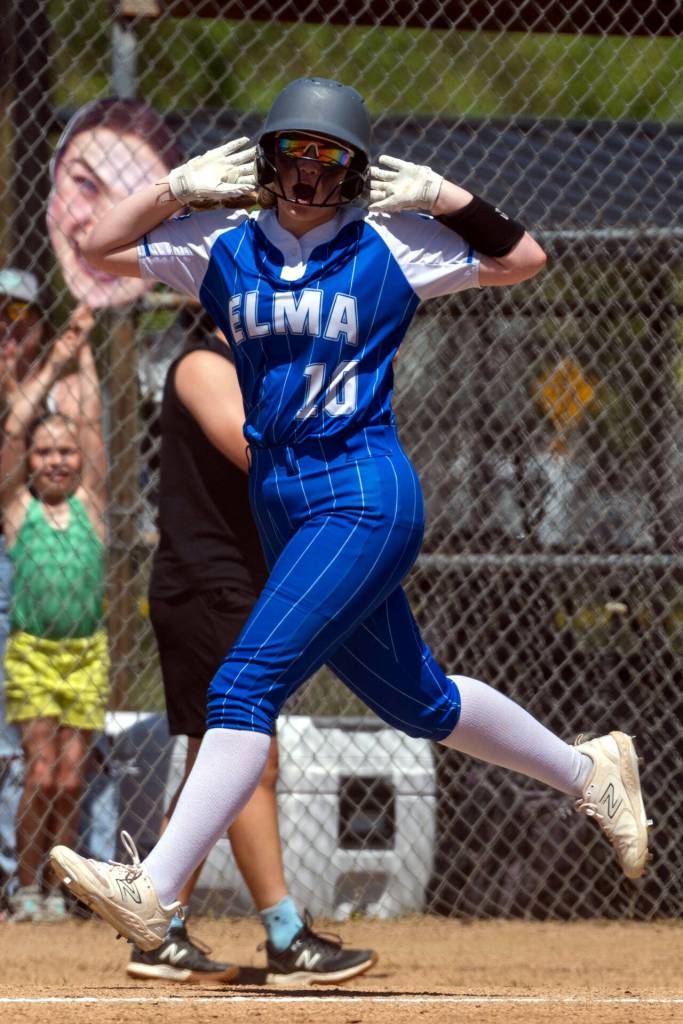 PHOTO BY FOREST WORGUM Elma third baseman Lynsee Bednarik celebrates after her solo home run in the bottom of the fourth inning in a 15-5 win over Columbia (White Salmon) during a 1A District 4 Tournament first-round game on Wednesday in Centralia.