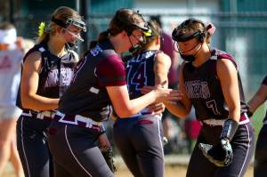 RYAN SPARKS / THE DAILY WORLD 
Montesano first baseman Kylee Wisdom (left) gives five to second baseman Alyssa Maldonado (7) during a 13-0 win over Hoquiam in a 1A District 4 semifinal game on Wednesday in Centralia.