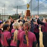 RYAN SPARKS | THE DAILY WORLD The Montesano Bulldogs raise the 1A District 4 championship trophy after beating Seton Catholic 5-3 on Saturday in Centralia.