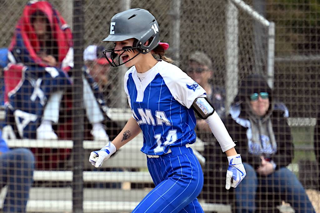 PHOTO BY CHRYSTAL WELD Elma outfielder Aaleigha Weld heads home after hitting a grand-slam home run in a 24-10 win over La Center in a 1A District 4 Tournament game on Saturday in Centralia.