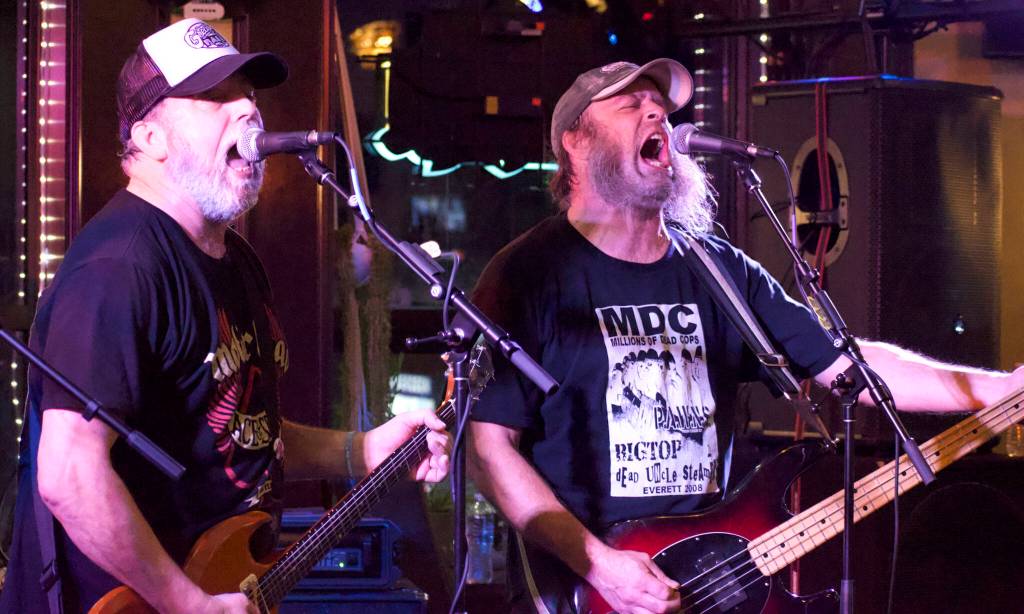 Matthew N. Wells / The Daily World
Earle Thunders, left on guitar, and Jeromy Leonard, right on bass, of The Swaggerlies, hammer and scream their hearts out as part of the closing act, of Redact Records last scheduled show  Saturday night  at Messy Jessys Bar and Grill. Their set provided the venue an 80s-era metal sound, which made Thunders Motörhead shirt all too perfect for the four-man band.