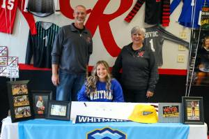 PHOTO BY LARRY BALE 
Raymond senior Kyndal Koski (sitting) signed a Letter of Intent to play volleyball for Whitman College in the fall. Koski is pictured with Raymond Athletic Director Mike Tully (left) and Raymond-South Bend head volleyball coach Julie Jewell.
PHOTO BY LARRY BALE Raymond senior Kyndal Koski (sitting) signed a Letter of Intent to play volleyball for Whitman College in the fall. Koski is pictured with Raymond athletic director Mike Tully (left) and Raymond-South Bend head volleyball coach Julie Jewell.