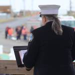Michael S. Lockett / The Daily World
South Beach Regional Fire Authority Chaplain Coleena Curry reads from a religious text during the annual Blessing of the Fleet in Westport on Sunday.