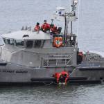 Coast Guardsmen from Station Grays Harbor lay a memorial wreath during the Blessing of the Fleet ceremony on Sunday in Westport. (Michael S. Lockett / The Daily World)