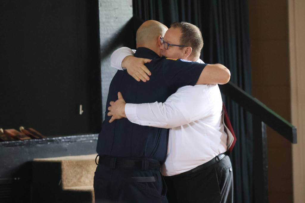 Michael S. Lockett / The Daily World
Ocean Shores Fire Chief Brian Ritter hugs Ricardo Martinez, class president of his fire academy class, during graduation on Saturday.
