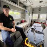 Michael S. Lockett / The Daily World
County Coroner George Kelley points out a feature in the former ambulance the coroners office recently purchased to support expanded operations.