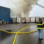 Firefighters work to extinguish a trash fire early Sunday morning at the garbage transfer station between Central Park and Montesano. (GHFD2)