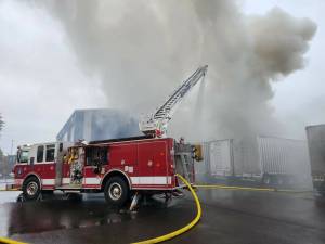 Firefighters work to extinguish a trash fire early Sunday morning. (GHFD2)