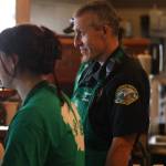 Emergency responders spent time on the line serving drinks during the Badges and Brews event hosted by the Aberdeen Starbucks. (Michael S. Lockett / The Daily World)
