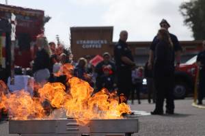The Aberdeen Fire Department brought out its fire extinguisher use demonstrator during the Badges and Brews event hosted by the Aberdeen Starbucks. (Michael S. Lockett / The Daily World)