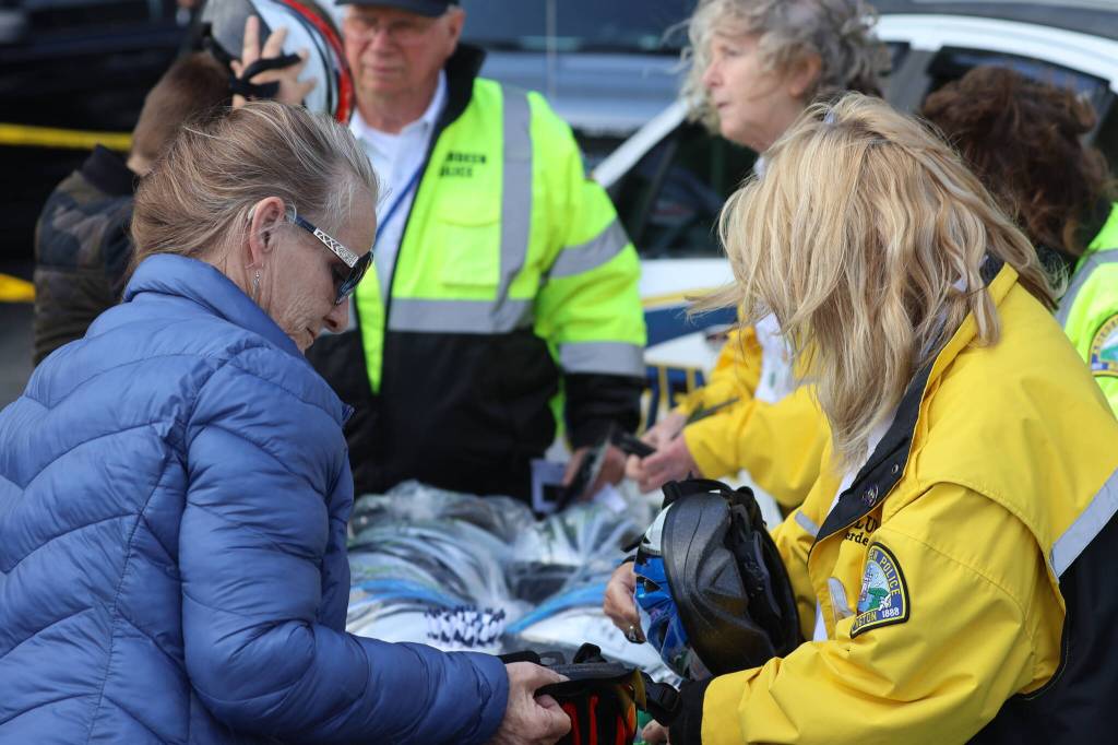 Various agencies gave out safety equipment during the Badges and Brews event hosted by the Aberdeen Starbucks. (Michael S. Lockett / The Daily World)
