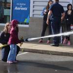 Children got a chance to try fire and police equipment during the Badges and Brews event hosted by the Aberdeen Starbucks. (Michael S. Lockett / The Daily World)
