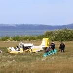 A plane crashed at Ocean Shores Municipal Airport on Saturday, June 8, from an unknown cause, injuring two. (Michael S. Lockett / The Daily World)