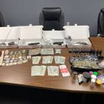 Four firearms, thousands of dollars in cash, a large amount of marijuana and ammunition was siezed in a suspected DUI stop in Aberdeen last week. (Courtesy photo / APD)