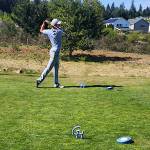 SUBMITTED PHOTO 
Grays Harbor College golfer Rasmus Tamker tees off during a GHC hosted meet in DuPont in late April. The college decided to suspend the mens golf and mens wrestling program on Monday.