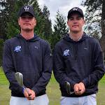 SUBMITTED PHOTO 
Grays Harbor College golfers Cole (left) and Brett Wasson pose for a photo during a NWAC League Match in April at Port Orchard. The college decided to suspend the mens golf and mens wrestling programs on Monday.