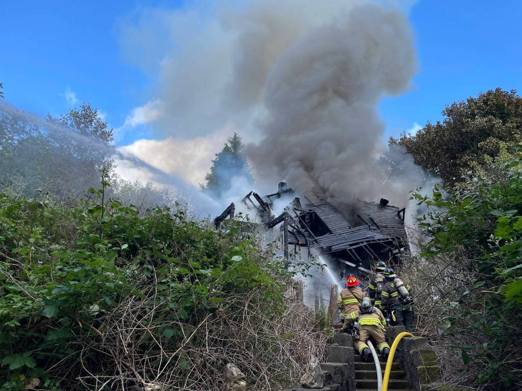 Michael S. Lockett / The Daily World
Thick vegetation complicated the response to a structure fire in Hoquiam on Tuesday.