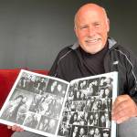 Matthew N. Wells / The Daily World
Darrell Westmoreland, a renowned music photographer who has led a career for other photographers to dream about, shows off a couple pages from his book Snap, Click Flash: All Access Pass, as he spoke to The Daily World about a bit of his career and the people, like Stan Foreman, who helped him along the way. Despite his success, Westmoreland remains grounded and humble.