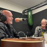 On Tuesday, Darrell Westmoreland, left, talks with Wil Russoul, right, and Roger Fisher of Heart, who called in to Johnny Mansons Local Matters radio show on 94.7 FM. Once Fisher called in, the official announcement was made that Westmoreland would receive his star on the Aberdeen Walk of Fame. (Matthew N. Wells / The Daily World)