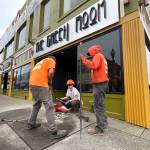 Matthew N. Wells / The Daily World
Aberdeen Public Works employees  from left, Jeff Stevens, Connor Reed and Max Acosta, bust the pavement on the patch of sidewalk that will host Darrell Westmorelands star on the Aberdeen Walk of Fame. The music photographer will be honored Saturday afternoon, at 1 p.m., as part of Aberdeen Founders Day.