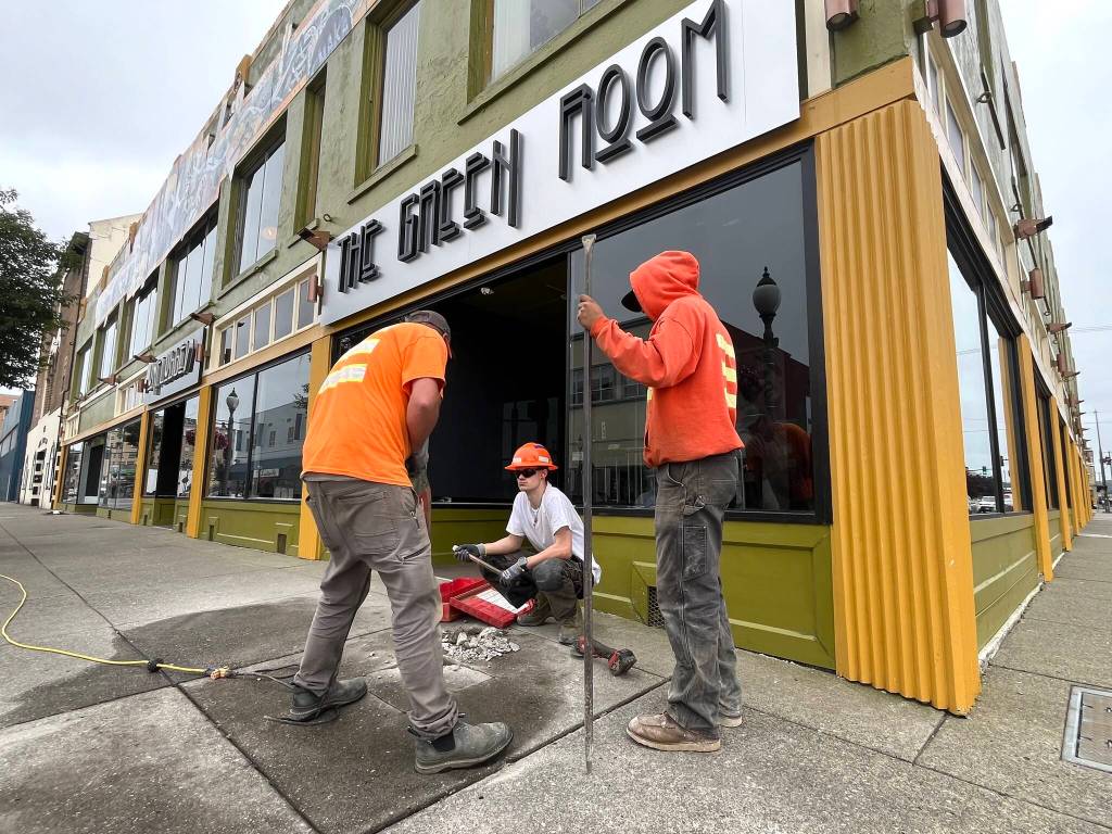 Matthew N. Wells / The Daily World
Aberdeen Public Works employees  from left, Jeff Stevens, Connor Reed and Max Acosta, bust the pavement on the patch of sidewalk that will host Darrell Westmorelands star on the Aberdeen Walk of Fame. The music photographer will be honored Saturday afternoon, at 1 p.m., as part of Aberdeen Founders Day.