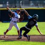 PHOTO BY FOREST WORGUM Montesano infielder Nolan Kohlmeier (left) makes a throw during a 12-4 win over Willapa Harbor in a District 3 Majors elimination game on Wednesday in Centralia.