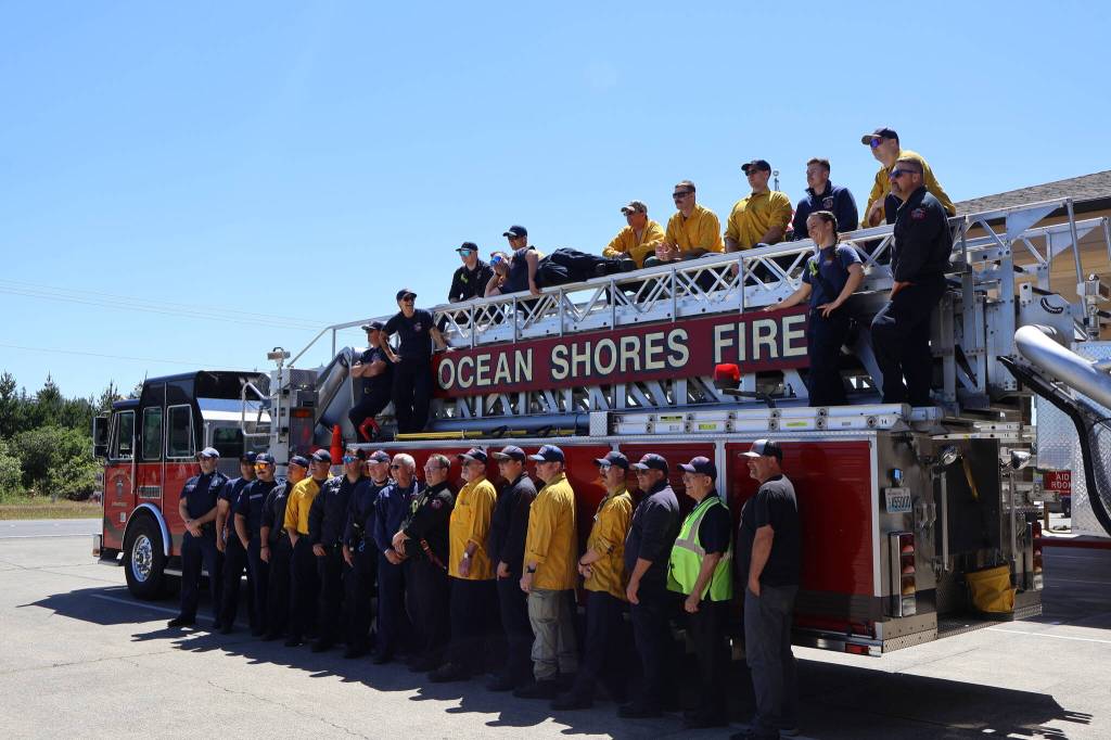Michael S. Lockett / The Daily World
Ocean Shores firefighters pose for a photo on the Fourth of July.