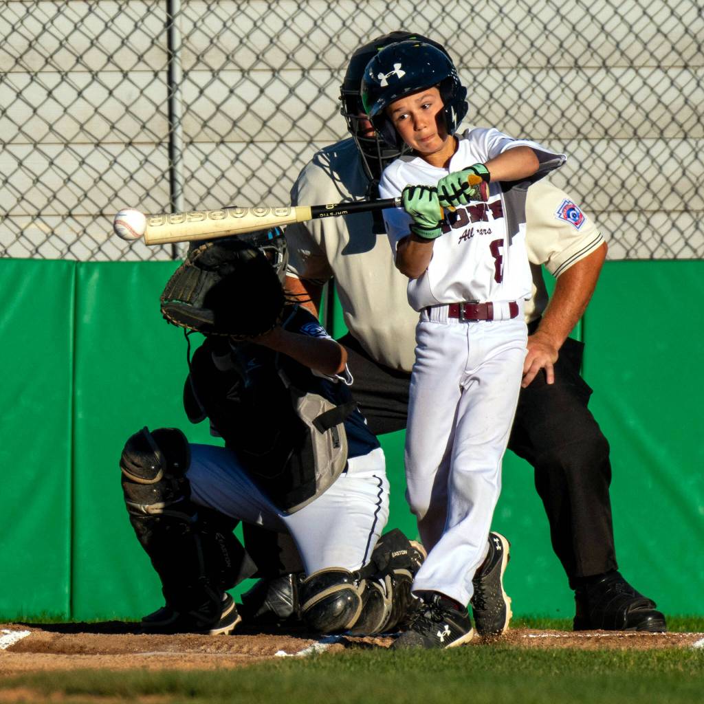 PHOTO BY FOREST WORGUM Montesanos Micah Eaton connects with a pitch during a 10-4 win over Larch Mountain in a 9-11 Division semifinal game of the Little League District 3 Tournament on Tuesday in Montesano.