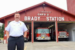 Michael S. Lockett / The Daily World
Chief John McNutt of Grays Harbor Fire District 2 stands in front of the Brady Station, currently having its siding replaced.
