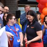 Matthew N. Wells / The Daily World
Caleb Browning, left in front, Orren Browning, and Shannon Browning  owner of the new Grocery Outlet in Elma  share a moment in front of Elma Mayor Josh Collette, who is behind Orren, and Rep. Mike Chapman, who is behind Shannon, and other excited folks, just after the ribbon-cutting that took place Thursday morning in Elma. The store opened Thursday morning with a parking lot so full people parked in the lots of neighboring businesses.