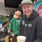 Matthew N. Wells / The Daily World
Nick Terrel, co-owner of Ember Goods, a coffee shop in Olympia, presents a free mocha complete with delicate foam art on Thursday morning at the grand opening of Grocery Outlet  10 Eagle Dr., in Elma. Terrel, who owns it with Logan Smith, whos behind Terrel, served about 200 customers in almost four hours. The duo kept busy for the next hour as well. But they were happy to offer the delicious hot drinks.
