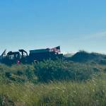Courtesy photo / OSFD
Ocean Shores firefighters mop up after a dune grass fire on Tuesday.