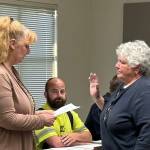 Sue Darcy, right, is sworn in as she joins the Cosmopolis City Council on Wednesday. (Michael S. Lockett / The Daily World)