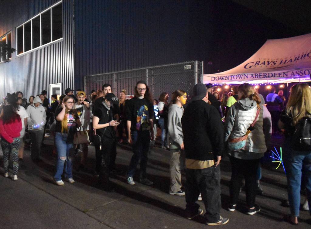 The line to the Aberdeen Rain Glow Festival was a long one, but it was full of patient people waiting to have a ball on Saturday night. The downtown festival took over the areas within Heron, Market, South K and Broadway streets. Judging by long lines like this, and the positive energy within the festival, it was a success. (Matthew N. Wells / The Daily World)