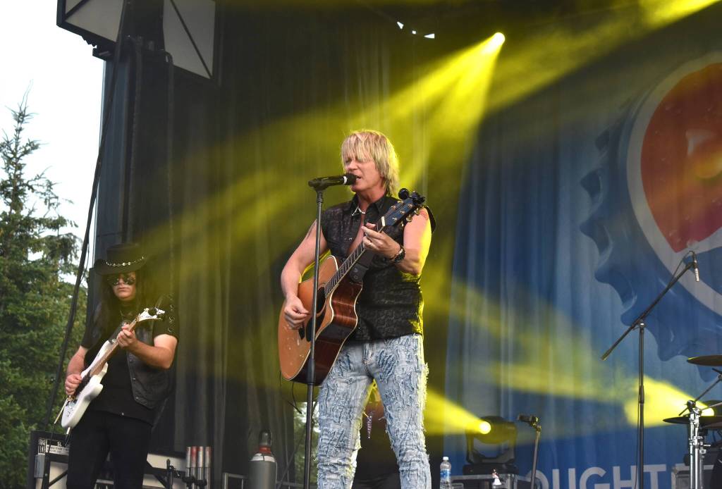 Matthew N. Wells / The Daily World
Doug Shepard, center, who is frontman for Crush Bon Jovi Experience, a Jon Bon Jovi cover band known for playing all of the rock stars hits, turned it up to 11 for their fans on Saturday night at the Grays Harbor County Fair.