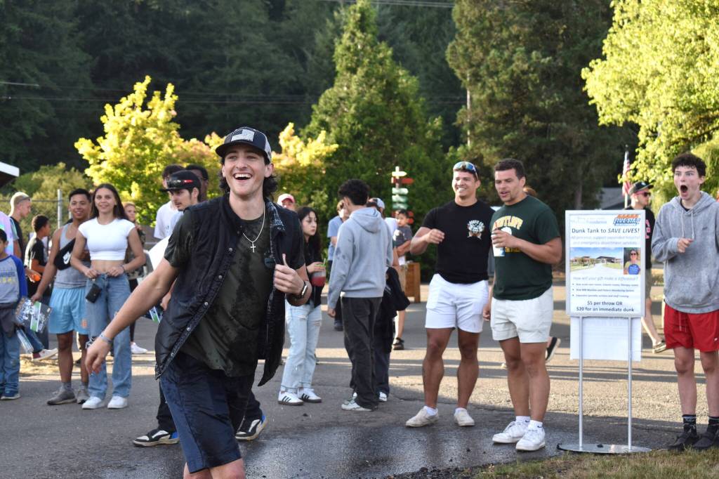 Matthew N. Wells / The Daily World
Parker Gleason has a blast throwing softballs at a target for a dunk tank that held Tariq Woolen, cornerback for the Seattle Seahawks. Gleason even paid the $20, which went to Summit Pacific Medical Center, in order to automatically dunk Woolen. Five Star Dealerships and Woolen teamed up Saturday to raise $870 for the hospital.