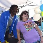 Matthew N. Wells / The Daily World
Tariq spent a couple hours between a cold dunk tank and a meet and greet at Five Star Dealerships tent on Saturday evening at Grays Harbor County Fair. Retha, one of the many Seahawks fans in attendance, was so happy to meet Woolen and to get him to sign the caricature drawing of her and her husband Paul.