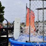 Sgt. Daniel Fode is elected to embrace the depths during a National Night Out event in Ocean Shores. (Michael S. Lockett / The Daily World)