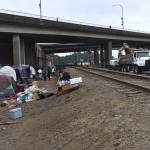 Matthew N. Wells / The Daily World
Much of the encampment was cleaned out by mid-morning on Wednesday, but there were unhoused people there figuring out what to do as a lot of city staffers, nonprofits and other people involved, tried to help move them out.
